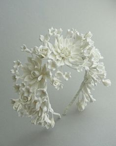 a bunch of white flowers sitting on top of a table