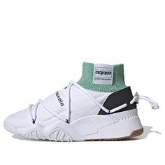 The Adidas Alexander Wang x Puff Trainer 'Core White' is a stylish and comfortable sneaker that is perfect for everyday wear. Made with a synthetic leather upper, this shoe is durable and easy to clean. The tonal stitch detailing gives the shoe a 'puffer' effect, while the green sock-like collar adds a pop of color. The woven logo tag and inverted Trefoil branding add a touch of luxury to this shoe. The oversized drawcord lacing system ensures a secure fit, while the gum rubber outsole provides Adidas Sporty High-top Sneakers With Rubber Sole, Functional Mid-top Custom Sneakers With Boost Midsole, Adidas Dynamic Sneakers With Rubber Sole, Adidas Athleisure Sneakers With Rubber Sole, Dynamic Adidas Sneakers With Rubber Sole, Sporty Slip-on High-top Sneakers With Vulcanized Sole, Adidas Sporty Custom Sneakers With Rubber Sole, Adidas Custom Sporty Sneakers With Rubber Sole, Adidas High-top Sneakers With Vulcanized Sole