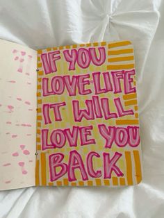 an open notebook with writing on it and the words if you love life, it will love you back