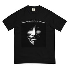 This stylish T-shirt combines historical significance with modern aesthetics. The design features a striking Guy Fawkes mask from the movie "V for Vendetta" on a deep black background, with the text "Remember, Remember, the 5th of November" above it. Made from high-quality cotton, this T-shirt offers not only great comfort but also a powerful statement. Ideal for fans of history, art, and rebellious spirit. Wear this unique shirt and make a statement! 100% ring-spun cotton * Fabric weight: 6.1 oz/yd² (206.8 g/m²) * Garment-dyed * Relaxed fit * 7/8″ double-needle collar * Twill-taped neck and shoulders for extra durability * Double-needle armhole, sleeve, and bottom hems * Blank product sourced from Honduras 5th Of November, Guy Fawkes Mask, V For Vendetta, Guy Fawkes, Spirit Wear, History Art, Unique Shirt, The 5th Of November, Deep Black