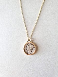 *Mercury Coin Pendant Necklace* -This necklace has a real vintage United States Mercury dime set in Solid 14K Gold with a 14k gold-fill chain -Bezel setting is open on the front and back so the coin can be own either way. -Pendant measures 7/8 inch. -Available in a 16in or 18in chain Heirloom Nickel-free Jewelry, Nickel-free Heirloom Jewelry For Anniversary, Timeless Handmade Yellow Gold Necklaces, Timeless Gold Necklace For Collectors, Timeless Handmade Yellow Gold Necklace, Heirloom Nickel-free Jewelry For Anniversary, Handmade 14k Gold Antique Jewelry, Vintage Gold Coin Brass Necklace, Vintage Gold Brass Coin Necklace