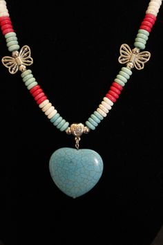 You can pick and choose your favorite color 'Dyed Howlite Stone Heart Pendant'--which are available in 3 colors--Coral; Turquoise; Bone.  Each necklace has 4-different colors in the donut beads--Turquoise Blue; Turquoise Green; Bone; Coral--which match perfectly with the Heart Pendants.  All the beads in this necklace set are 'Dyed Howlite Stone Beads' that resemble real Turquoise but without the real cost!  Each necklace also has four 'Silver Metal Butterflies' and metal silver accent pieces such as silver beads; metal bails which may have a flower accent or a heart design (depending on inventory).  This necklace also features an extra large lobster clasp for an easy connection.  Earrings are also included in the price of this beautiful set.   Heart Pendant size:  1 1/2" x 1 1/2" Metal Butterflies, Heart Butterfly, Howlite Stone, Heart Pendants, Real Turquoise, Turquoise Heart, Turquoise Green, Stone Heart, Coral Turquoise