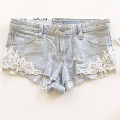 Elevate Your Festival Or Bohemian Style With These Bdg Lace Dolphin Low Rise Jean Denim Embroidered Shorts. Made From 100% Cotton Denim Fabric, These Shorts Feature A Blue Color With Lace Accents And A Cut-Off Style. The Size Is 25 Inches In Waist Size And Is Regular Fit. Perfect For Travel Or Casual Occasions, These Shorts Are A Classic Addition To Your Wardrobe. The Dolphin Embroidery Adds A Touch Of Charm To The Overall Design. Made In Mexico, These Shorts Are A Must-Have For Any Fashion-Forw Summer Denim Bottoms With Lace Trim, Denim Bottoms With Lace Trim For Summer, Dolphin Embroidery, Jeans With Lace, Lace Jean Shorts, Tumblr Summer, Low Rise Jean Shorts, Hollister Jean Shorts, Low Rise Jean