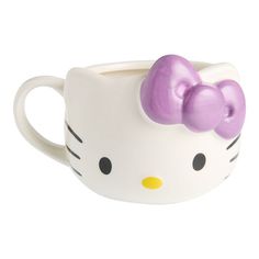 a hello kitty mug with a bow on it