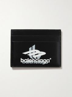 Balenciaga continues to borrow from popular culture, this cardholder is made from smooth leather and printed with a logo inspired by retro gaming. It has four card slots and an additional compartment for bills or receipts. Classic Business Card Holder With Logo, Black Leather Card Holder With Logo, Classic Black Card Holder With Logo, Designer Logo Card Holder For Business, Designer Business Card Holder With Logo, Designer Business Wallets With Logo, Designer Business Wallet With Logo, Designer Rectangular Card Holder With Logo, Black Luxury Card Holder With Engraved Logo