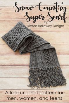 a gray knitted scarf laying on top of a wooden floor