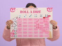 a woman holding up a pink and white board with the words roll a dice on it