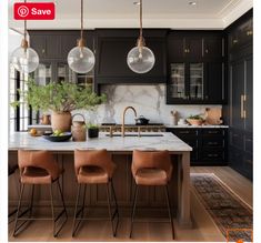 an image of a kitchen with black cabinets and marble counter tops on sale for $ 1, 500