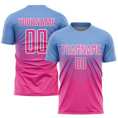 a pink and blue soccer jersey with the number 00 on it, in front of a white