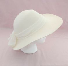 Up for sale today is this gorgeous vintage cream colored felt ladies hat. It is in very good but not perfect condition, with a couple of small stains on the bottom of the hat brim. The entire exterior of the hat is very clean. the brim is 21 inches. What a perfect addition to your wardrobe!   Please carefully examine all pictures before purchasing.  The pictures are an important part of the description, and usually include important measurements. Items are in good pre-owned condition unless othe Dream Items, Ladies Hat, Wedding Plan, Hats Vintage, Cream Color, Hats For Women, White Flowers, Light Colors, A Couple