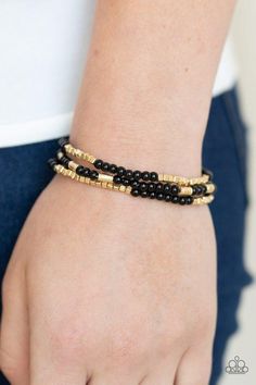 A dainty collection of black beads, shimmery gold cubes, and glistening gold accents are threaded along stretchy bands around the wrist, creating colorful layers. Sold as one set of three bracelets. Trendy Fringe, Gold Bracelet Set, Feeling Pretty, Black Bracelet, Gold Bead Bracelets, Ball Necklace, Black Bracelets, Paparazzi Accessories, White Rhinestone