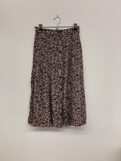 Vintage floral skirt with buttonsApproximate Size: 13 W; 29 L Floral Print Flowy Skirt, Floral Print Flowy Midi Skirt, Flowy Floral Print Midi Skirt, Floral Print Long Skirt For Day Out, Spring Long Skirt With Buttons, Chic Wide-leg Skirt With Floral Print, Casual Ditsy Floral Print Skirt For Day Out, Casual Tiered Skirt With Button Closure, Casual Flowy Skirt With Ditsy Floral Print