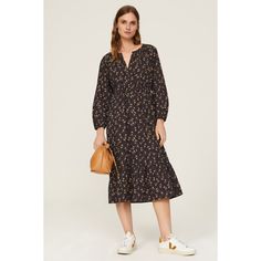 Black floral cotton blend (55% Cotton, 45% Tencel). Hourglass. Long sleeves. Crewneck. Front button closure. 46.5" from shoulder to hemline. Imported. Cotton Midi Dress For Day Out In Fall, Cotton Midi Dress For Fall Day Out, Cotton Midi Dress With Floral Print For Work, Casual Cotton Midi Dress With Floral Print, Cotton Floral Print Midi Dress, Fall Midi Dress With Ditsy Floral Print, Fall Midi Length Ditsy Floral Print Dress, Fall Ditsy Floral Print Day Out Dress, Fall Ditsy Floral Print Day Dress