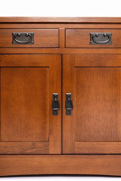 a wooden cabinet with two doors and one drawer on the front side, is shown