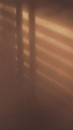 the shadow of a clock on a wall