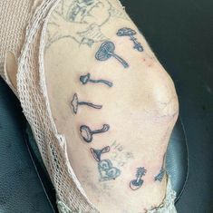 a person's foot with tattoos on it