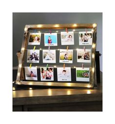 a light up photo frame with pictures on it and string lights around the edges to hold photos