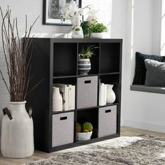 Add function and style to your home with the Better Homes & Gardens 9-Cube Storage Organizer. Available in multiple finishes, including both solid and wood grain options, this cube organizer features nine 13" x 15" x 13" compartments, the perfect size to display books, collectibles, photos, artwork, storage bins and baskets. An open back design makes it easy to manage cords and cables. The top panel of this sturdy bookcase supports up to 100 lbs and each cube supports up to 30 lbs. Combine it wi Cube Storage Decor, Cubbies Storage, Artwork Storage, Display Books, Cube Storage Bins, Furniture Bookshelves, Cubby Storage, Etagere Bookcase, Cube Organizer