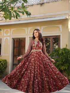 Maroon Rayon Flared Printed Gown Bollywood Anarkali Set With Floral Print And Long Sleeves, Bollywood Style Long Sleeve Anarkali Set With Floral Print, Red Long Sleeve Kurta With Floral Print, Designer Georgette Dress With Floral Print, Festive Long Sleeve Floral Anarkali Set, Designer Red Floral Print Dresses, Formal Long Anarkali Gown, Long Anarkali Gown For Formal Occasions, Wedding Maxi Anarkali Set With Printed Motifs