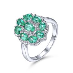 Limited time price. The round emerald stones are very clear, and the color is dark green. Very high-quality silver finish, it does not tarnish.  The diamond is SI1 clarity and G color. All out Emeralds originate from Zambia. Silver 3.80g. Emerald 1.867ct. Diamond 0.036ct. Size #8 Fine Jewelry Emerald Ring With Accent Stones, Fine Jewelry Emerald Ring With Cubic Zirconia, Fine Jewelry Cubic Zirconia Emerald Ring With Accent Stones, Emerald Rings With Diamond White Halo Setting, Exquisite Brilliant Cut Emerald Promise Ring, Tsavorite Emerald Ring, Green Diamond Multi-stone Birthstone Ring, May Birthstone Diamond Cluster Ring With Gemstones, Diamond White Emerald Ring With Round Cut