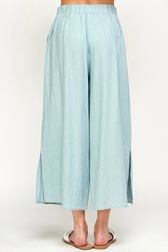 Get ready to make a statement with our Gabbie Linen Pants! In a fun, bold color, these classic pants are perfect for the spring and summer. Just pair them with a basic white top and some cool shoes for a stylish look. Stand out from the crowd and let your playful side shine! Casual Wide Leg Bottoms For Spring, Casual Relaxed Fit Bottoms For Spring, Casual Wide-leg Linen Capris, Relaxed Spring Bottoms With Pockets, Spring Beach Wide Leg Pants, Chic Linen Bottoms For Day Out, Summer Loungewear Solid Color Bottoms, Relaxed Cotton Pants For Summer, Casual Beach Bottoms For Spring