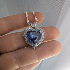 This gorgeous Sterling Silver cubic zirconia studded Tanzanite heart necklace and earring set would make the perfect classy gift for a bridesmaid, as an anniversary gift, for Valentine's Day or for Mother's Day. Tanzanite is the birthstone for those born in December, making it a thoughtful birthday gift as well! Pictures were taken both indoor and outdoors to best represent color. ~Measurements~ The heart pendant measures 1" tall and 3/4" wide. The Tanzanite heart stone is 12mm x 12mm. The match Born In December, Well Pictures, Tanzanite Jewelry, Jewelry Heart, Heart Stone, Jewelry Bridal, Necklace And Earring Set, December Birthstone, Hair Accessories Jewelry