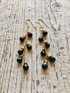 Gold filled dangle earrings wire wrapped with black onyx gemstones Elegant Onyx Wire Wrapped Jewelry, 14k Gold Filled Wire Wrapped Drop Jewelry, Black Dangle Linear Earrings, Nickel-free Black Long Drop Jewelry, Black Sterling Silver Long Drop Jewelry, Nickel Free Black Long Drop Earrings, Black Dangle Linear Earrings For Pierced Ears, Nickel-free Black Long Drop Earrings, Black Teardrop Chandelier Earrings With Dangling Beads