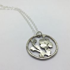 "This cherry blossom necklace is made with .925 sterling silver and includes an all sterling 18\" chain. This piece is cast in silver from my original hand fabricated work. Your order will come shipped in a brown paper gift box. This piece is also available in bronze: https://www.etsy.com/dreadnoughtworkshop/listing/469260626/cherry-blossom-pendant-necklace-bronze?utm_source=Copy&utm_medium=ListingManager&utm_campaign=Share&utm_term=so.lmsm&share_time=1534452608637 And also avail Blossom Color Sterling Silver Flower Jewelry, Silver Flower-shaped Necklaces For Gifts, Blossom Colored Flower-shaped Sterling Silver Jewelry, Sterling Silver Nickel-free Pendant Flower Necklace, Cherry Blossom Necklace, Paper Gift Box, Brown Paper, Sterling Silver Chain, Sterling Silver Chains