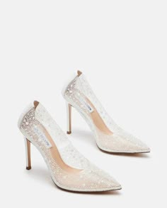 a pair of white high heeled shoes with sequins