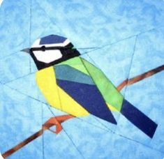 a colorful bird sitting on top of a wooden stick