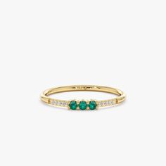 Celebrate the beauty of May with this dainty 14k or 18k solid gold emerald ring. A vibrant natural emerald takes center stage, complemented by a delicate diamond pavé band for a touch of sparkle. This minimalist design is perfect for stacking and makes a thoughtful birthday or birthstone gift. - Handmade - Solid Gold - Natural Diamonds and Emerald - Total Emerald Carat Weight: 0.09 ctw - Total Diamond Carat Weight: 0.05 ctw  - G Color, SI Quality Diamonds - Height of the Setting: 2.1 mm - Band Thickness: 1.3 mm 🛠 Your Sarah Elise piece is handcrafted with care! Ready-to-ship items go out within 3 business days. Made-to-order pieces typically take 7-10 business days to create. If you need something sooner, please contact us - we'll see if we can make it happen! For estimated shipping dates Yellow Gold Emerald Jewelry With Half Eternity Detail, Timeless Yellow Gold Emerald Birthstone Ring, Heirloom Yellow Gold Stackable Emerald Ring, Heirloom Stackable Emerald Ring In Yellow Gold, 14k Gold Half Eternity Emerald Ring For May Birthstone, 14k Gold Emerald Half Eternity Ring For May Birthstone, Luxury Yellow Gold Emerald Ring With Birthstone, Elegant 14k Gold Half Eternity Emerald Ring, Fine Jewelry 14k Gold Half Eternity Birthstone Ring