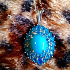 Stunning, Stunning, Stunning Natural Arizona Sleeping Beauty Turquoise (Oval 11 X 9 Mm) Malgache Neon Apatite Cocktail Pendent Necklace With A 20 In Chain. All Set In Platinum Vermeil Over Sterling Silver ( 7g ) 5.15 Ctw Est. Retail: 1350.00 Nwt. Nib. The Sleeping Beauty Mine Is Now Closed Turquoise Is The Birthstone For The Month Of December This Is A Wonderful Opportunity To Own A Piece Of American History Luxury Blue Cabochon Gemstones, Elegant Blue Gemstones With Polished Finish, Blue Multi-stone Necklaces For Anniversary, Luxury Blue Turquoise Gemstone Necklace, Blue Multi-stone Oval Necklaces, Blue Oval Multi-stone Necklaces, Oval Blue Multi-stone Necklaces, Exquisite Blue Teardrop Jewelry, Formal Blue Cabochon Necklace