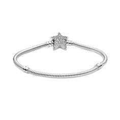 Bring celestial sparkle to your look with the Pandora Moments Asymmetric Star Clasp Snake Chain Bracelet. Hand-finished in sterling silver, the bracelet's star-shaped clasp is covered by sparkling clear cubic zirconia pavé on both sides. It can be worn with up to 16-18 desired charms and clips. Wear it on its own for a simple, understated look, or stack it with other celestial-inspired designs for a look that’s out of this world. Bracelet Pandora, Cz Bracelet, Snake Chain Bracelets, Precious Jewels, Mesh Bracelet, Pandora Bracelets, Bracelet Clasps, Bracelet Collection, Pandora Bracelet