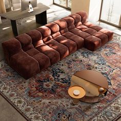 a large sectional couch sitting on top of a rug