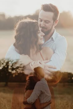 a man and woman embracing each other in a field