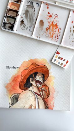 an artist's watercolor painting with paintbrushes and paints