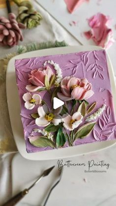 a close up of a cake with flowers on it