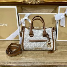 Michael Kors Small Messenger Handbag Nwt No Flaws Color Is Vanilla And Brown Nylon Interior Adjustable Strap Size Is 8”L X 3.5”W X 6”H Authentic White Coated Canvas Shoulder Bag With Removable Pouch, Michael Kors Beige Satchel With Detachable Handle, White Coated Canvas Bag With Removable Pouch, White Coated Canvas Bags With Removable Pouch, Michael Kors Cream Bag For Shopping, Michael Kors Beige Top Handle Shoulder Bag, White Coated Canvas Satchel Bag, Chic White Coated Canvas Bag, Michael Kors Beige Shoulder Bag With Detachable Handle