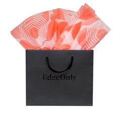 a black shopping bag with an orange and white pattern