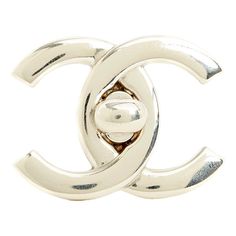 Chanel brooch SS1996 collection (!) with the motif of a large CC Chanel logo in silver metal, slanted pin on the back, signed. Width 3.8 cm x length 2.9 cm. The brooch has a few scratches from use but it is in very good vintage condition, delivered without invoice or original packaging, perfect on a jacket, a bag flap, as a belt buckle\\. This piece has an attribution mark,   I am sure that it is completely authentic and  take full responsibility for any authenticity   issues arising from misatt Designer Silver Brooches For Gifts, Luxury Silver Jewelry With Metal Logo, Elegant Formal Jewelry With Logo Plaque, Silver Metal Jewelry With Logo, Silver Metal Jewelry With Metal Logo, Luxury Silver Pins For Formal Occasions, Silver Elegant Enamel Pin For Formal Use, Silver Elegant Enamel Pin For Formal Events, Elegant Silver Enamel Pin For Formal Occasions