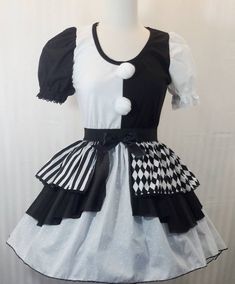 a mannequin wearing a dress with black and white designs on it's chest