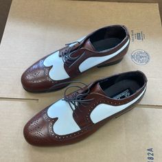 Brown And White Two Tone Wingtip Leather Dress Shoes Size 10.5 Wide Retro Fitted Oxfords With Leather Sole, White Cap Toe Oxfords For Derby, White Wingtip Oxfords For Office, White Wingtip Oxfords For Business, White Brogue Dress Shoes With Plain Toe, White Rubber Sole Dress Shoes For Derby, White Leather Shoes With Plain Toe For Office, White Dress Shoes With Rubber Sole For Derby, White Dress Shoes With Brogue Detailing