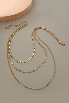 Here is a sophisticated Pretty and practical multi chain necklace that has a unique round chain and link chain. DIMENSION length: 22", 18", 15" ext: 3" Ball Chain Ext clasp: Lobster Claw metal finish: Gold Plated product Cheap Clavicle Chain Necklaces For Summer, Cheap Summer Clavicle Chain Necklaces, Cheap Multi-strand Layered Necklace With Clavicle Chain, Cheap Multi-strand Layered Necklace With Delicate Chain, Cheap Multi-strand Chain Necklace As Gift, Cheap Delicate Multi-strand Chain Necklace, Cheap Minimalist Multi-strand Chain Necklace, Cheap Gold Multi-strand Chain Necklace, Affordable Multi-strand Layered Necklace With Delicate Chain