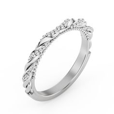 a white gold wedding ring with an intricate design