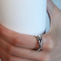 - Handcrafted sterling silver plated band ring - Features a beautiful Mobius design - Vibrant yet minimalist rainbow color design symbolizing love and pride - Perfect for Pride Month celebrations or as a thoughtful LGBTQ gift - Minimalist and versatile design, suitable for everyday wear - Available in various sizes (open and adjustable band) for couples to match and celebrate their love Rainbow Sterling Silver Rings As Gift, Rainbow Sterling Silver Promise Ring, Modern Rainbow Jewelry For Gifts, Modern Rainbow Jewelry For Gift, Modern Rainbow Jewelry Gift, Modern Rainbow Colored Jewelry For Gifts, Mobius Ring, Rainbow Rings, Love And Pride