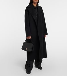 Malika Wool Blend Coat in Black - The Row | Mytheresa Black Evening Outerwear With Concealed Placket, Luxury Oversized Wool Coat With Long Sleeves, Luxury Long Wool Outerwear, Luxury Long Wool Coat For Formal Occasions, Timeless Black Wool Coat For Winter, Oversized Luxury Wool Coat, Black Cashmere Wool Coat For Winter, Winter Black Cashmere Wool Coat, Chic Long Cashmere Coat