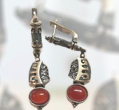 Exquisite handmade silver earrings with semi-precious stone and hieroglyphic carvings. Traditional Silver Agate Jewelry, Elegant Carnelian Earrings Gift, Elegant Carnelian Earrings For Gift, Antique Handmade Drop Clip-on Earrings, Elegant Silver Carved Earrings, Vintage Earrings With Natural Stones For Gift, Vintage Natural Stone Earrings For Gift, Traditional Sterling Silver Earrings With Natural Stones, Antique Handmade Clip-on Earrings As Gift