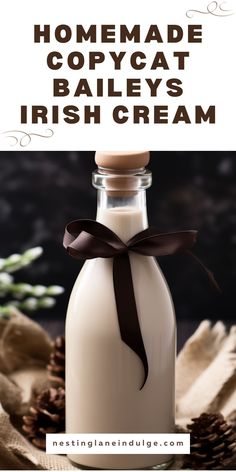 homemade copycat bailey's irish cream in a glass bottle with a brown ribbon