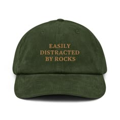 🎉 "Easily Distracted by Rocks" Embroidered Corduroy Hat 🪨✨ A hat made of corduroy? That's a yes! Our "Easily Distracted by Rocks" embroidered corduroy hat is the ultimate accessory for geology enthusiasts, nature lovers, and anyone who can't resist the allure of a cool rock. Whether you're a student, a seasoned geologist, or just love exploring the great outdoors, this hat is a fun and stylish way to show off your passion. Key Features: 🪨 100% Cotton Corduroy: Enjoy the softness, durability, Cheap College Baseball Cap, Cheap Cute Unisex Hats, Cheap Fun Style Baseball Cap For Outdoor, Cheap Fun Snapback Hat For Baseball Season, Cheap Fun-style Baseball Cap, Cheap Vintage Fitted Hat For Streetwear, Affordable Brown Vintage Trucker Hat, Cheap Funny Cap Style Hat, Cheap Themed Cap