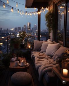 a couch sitting on top of a wooden floor next to a window covered in lights